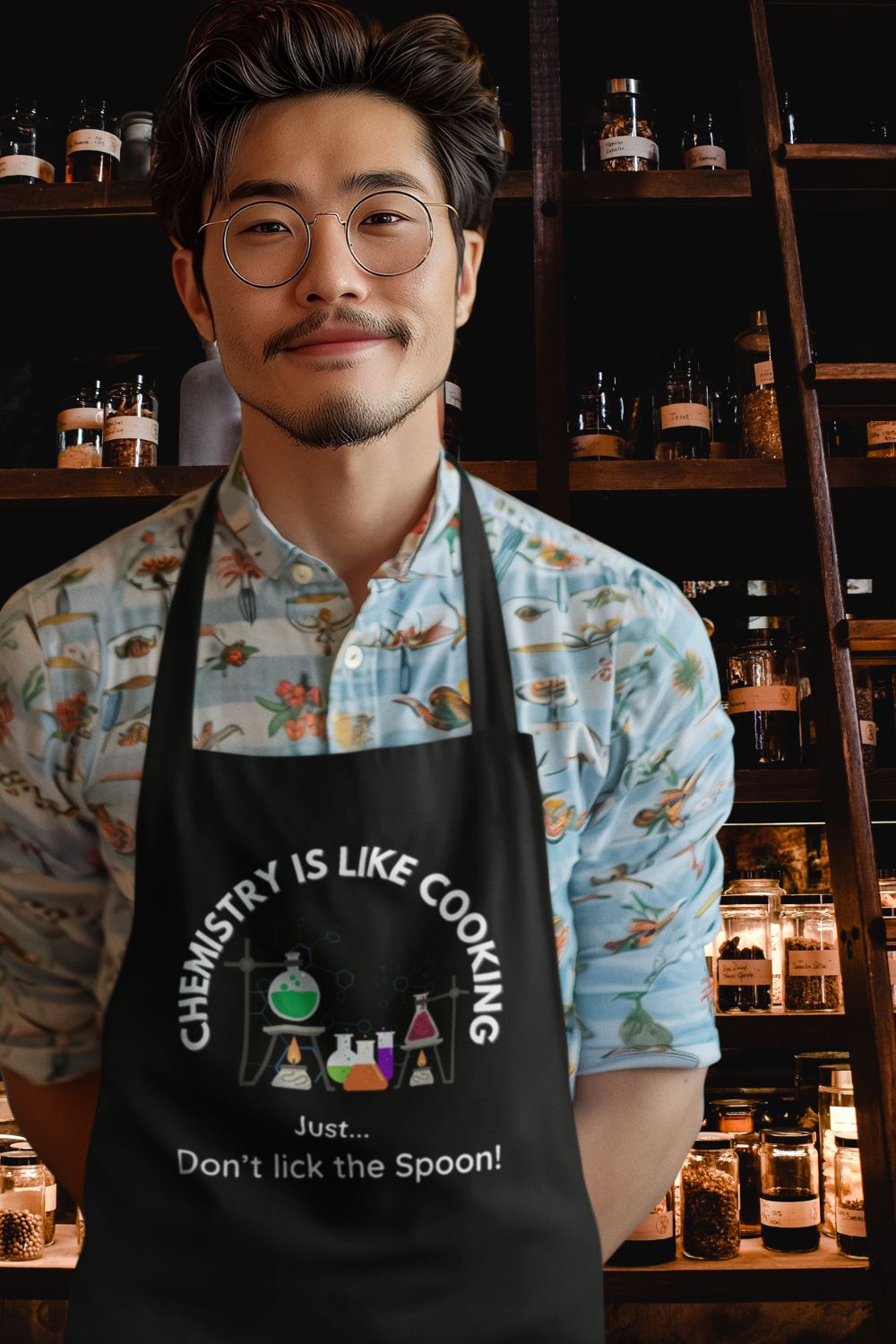 Funny Science Apron – "Chemistry Is Like Cooking... Just Don’t Lick the Spoon!" (Black, Grey, Red)