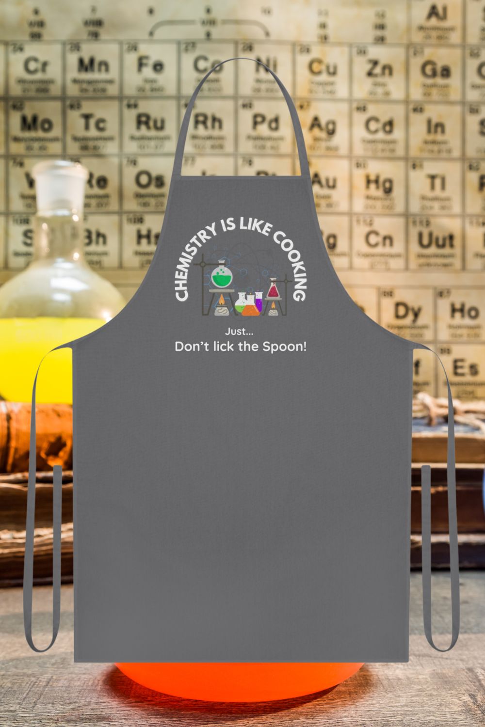 Funny Science Apron – "Chemistry Is Like Cooking... Just Don’t Lick the Spoon!" (Black, Grey, Red)