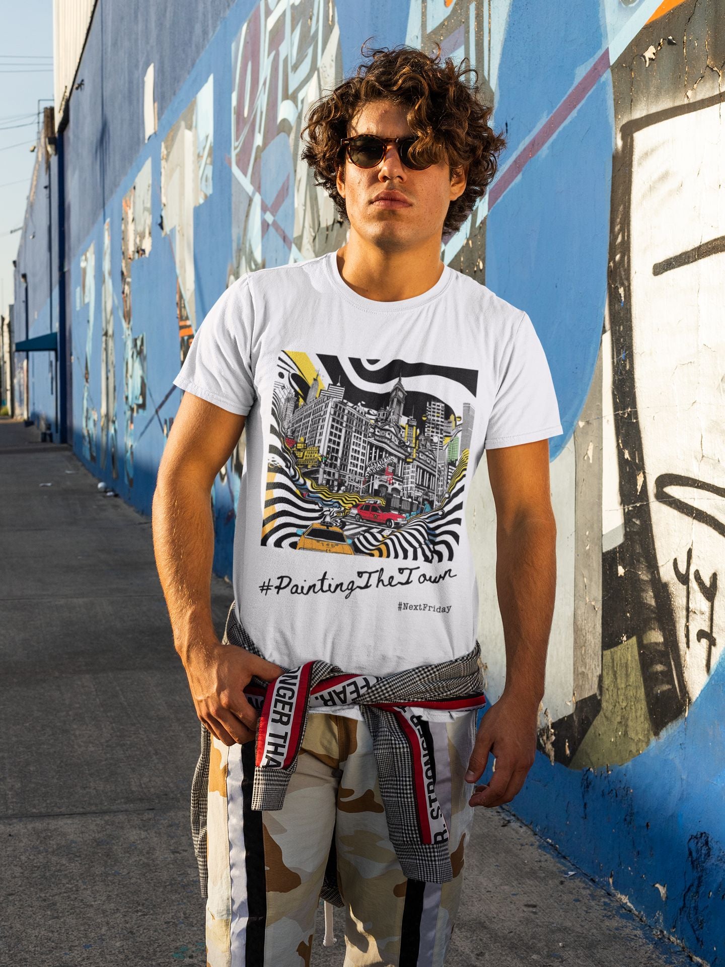 Urban Vibrance: Street Art-Inspired Monochrome Cityscape Unisex T-Shirt – 'Painting the Town'